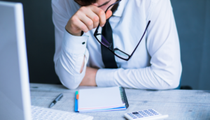 man looking at notes